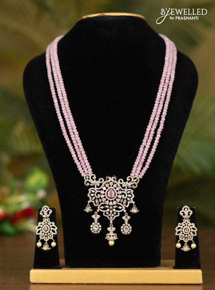 Beaded triple layer baby pink necklace with double peacock pendant in victorian finish
