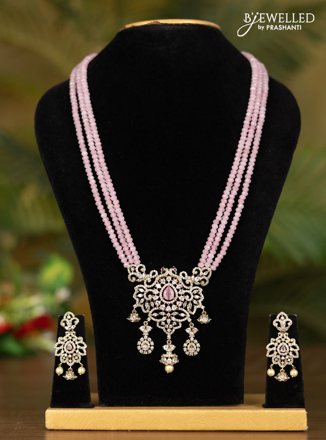 Beaded triple layer baby pink necklace with double peacock pendant in victorian finish