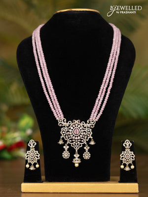 Beaded triple layer baby pink necklace with double peacock pendant in victorian finish