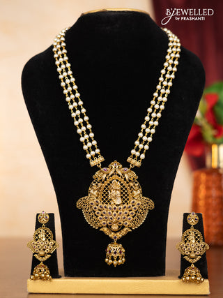 Pearl triple layer haaram radha krishna pendant with ruby stones and golden beads hangings