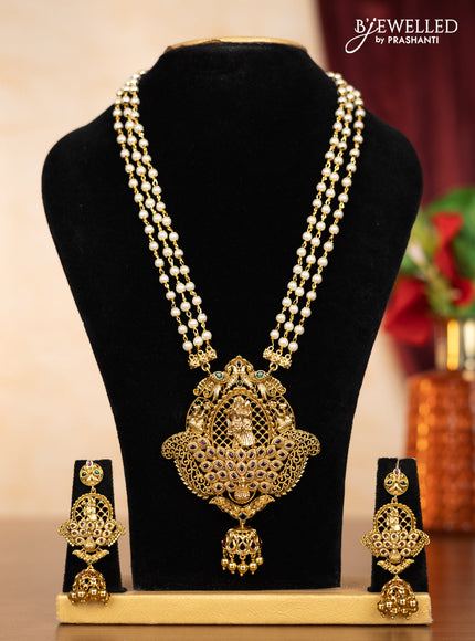 Pearl triple layer haaram radha krishna pendant with kemp stones and golden beads hangings