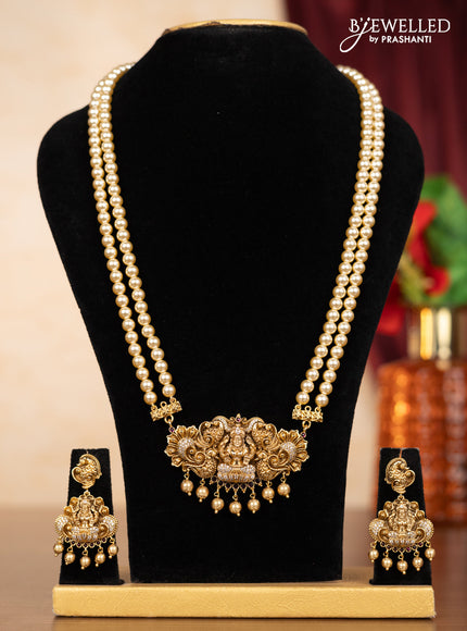 Pearl double layer haaram lakshmi pendant with ruby & cz stones and golden beads hangings