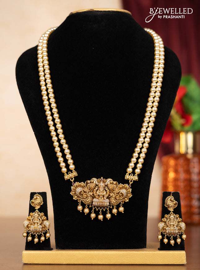 Pearl double layer haaram lakshmi pendant with ruby & cz stones and golden beads hangings