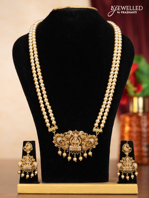 Pearl double layer haaram lakshmi pendant with ruby & cz stones and golden beads hangings