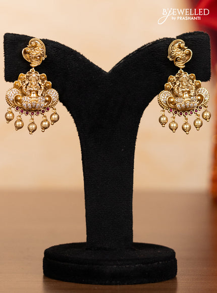 Pearl double layer haaram lakshmi pendant with ruby & cz stones and golden beads hangings