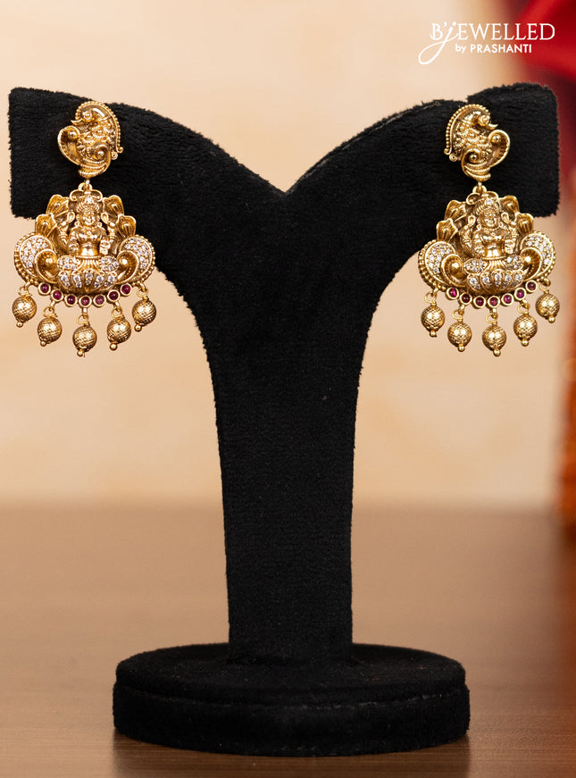 Pearl double layer haaram lakshmi pendant with ruby & cz stones and golden beads hangings