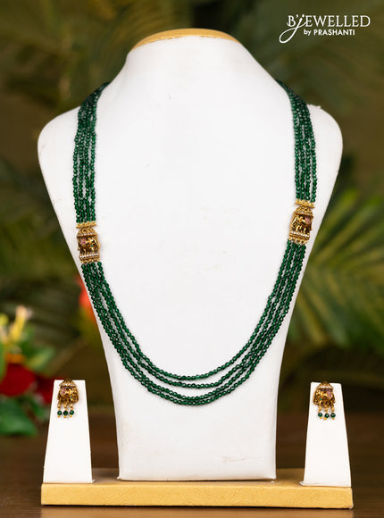 Beaded dark green necklace with antique elephant pendant in kemp stones