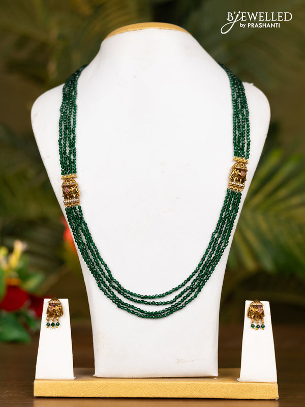 Beaded dark green necklace with antique elephant pendant in kemp stones