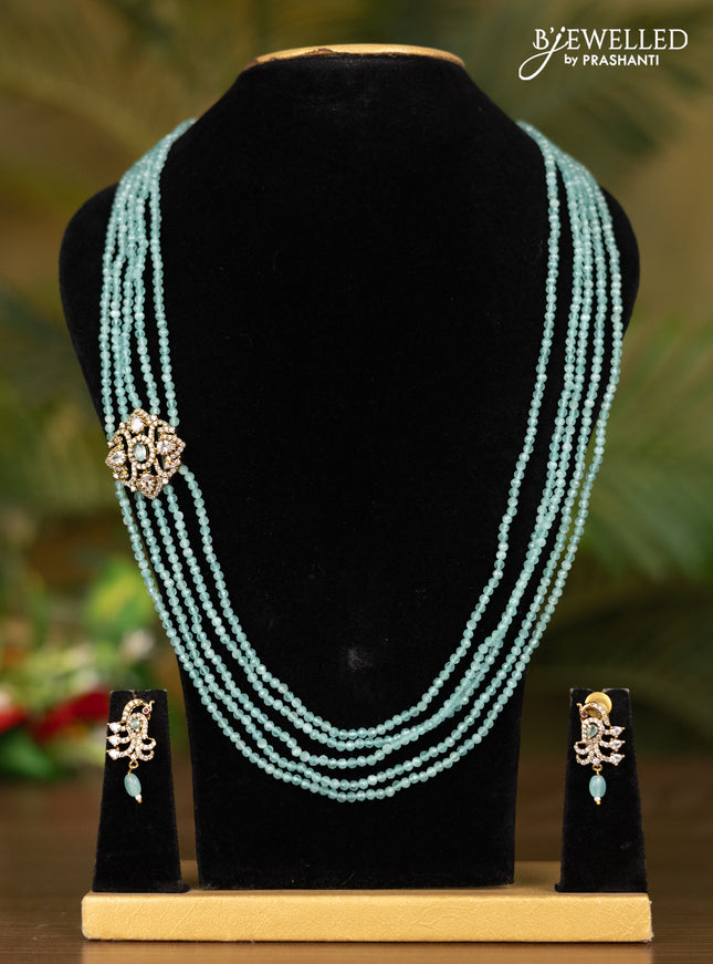Beaded multilayer teal blue necklace with peacock pendant in victorian finish