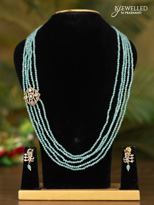 Beaded multilayer teal blue necklace with peacock pendant in victorian finish