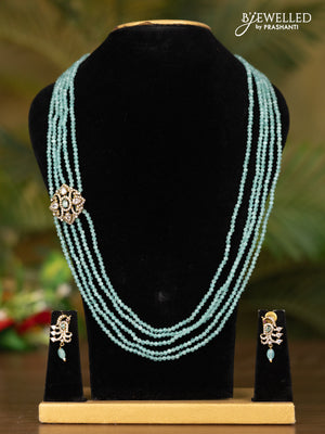 Beaded multilayer teal blue necklace with peacock pendant in victorian finish
