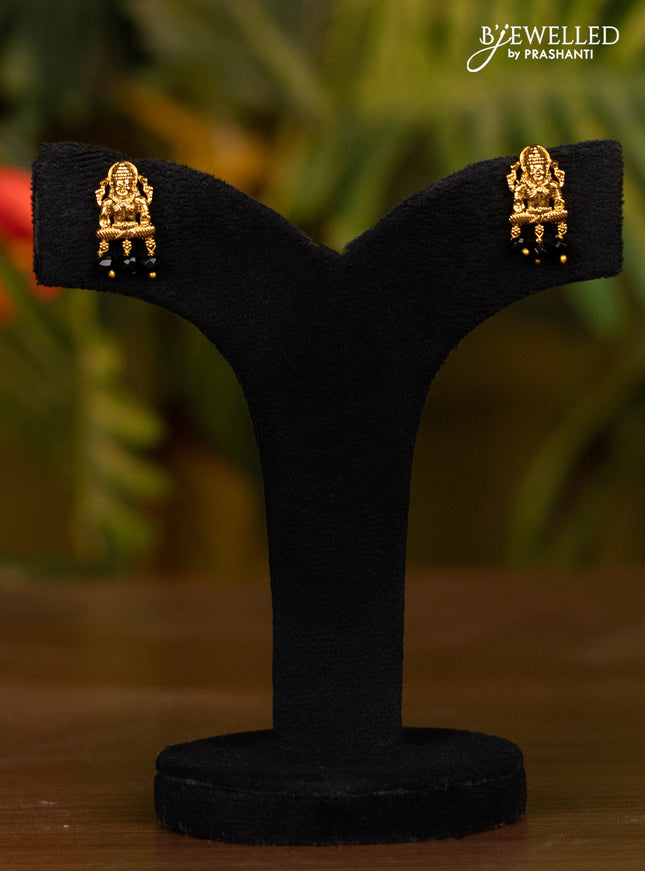 Beaded black necklace with antique lakshmi pendant in white stones