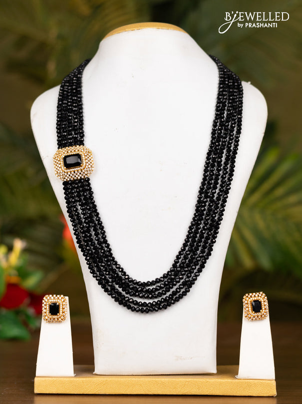 Beaded black necklace with white stones pendant