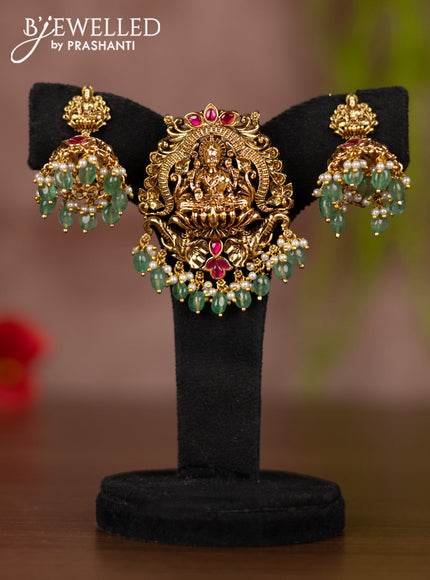 Antique pendant set lakshmi design with pink jadau stones and mint green beads hangings