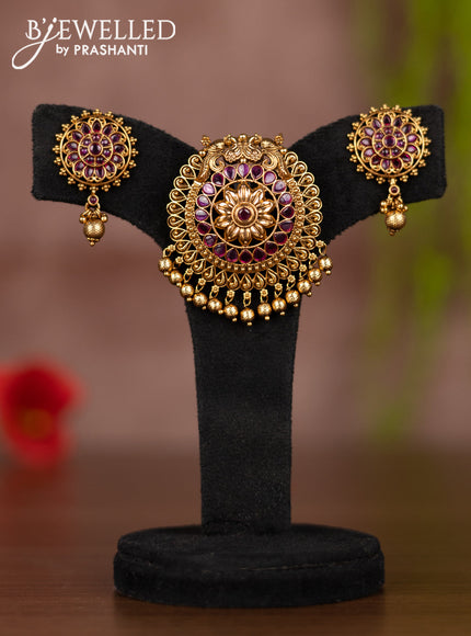 Antique pendant set with ruby stones and golden beads hangings