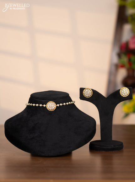 Pearl choker with floral pendant in white stones