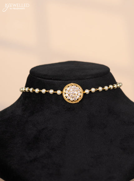 Pearl choker with floral pendant in white stones