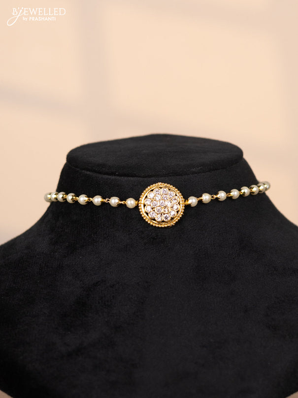 Pearl choker with floral pendant in white stones