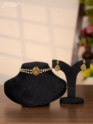 Pearl choker with lakshmi pendant in cz and kemp stones