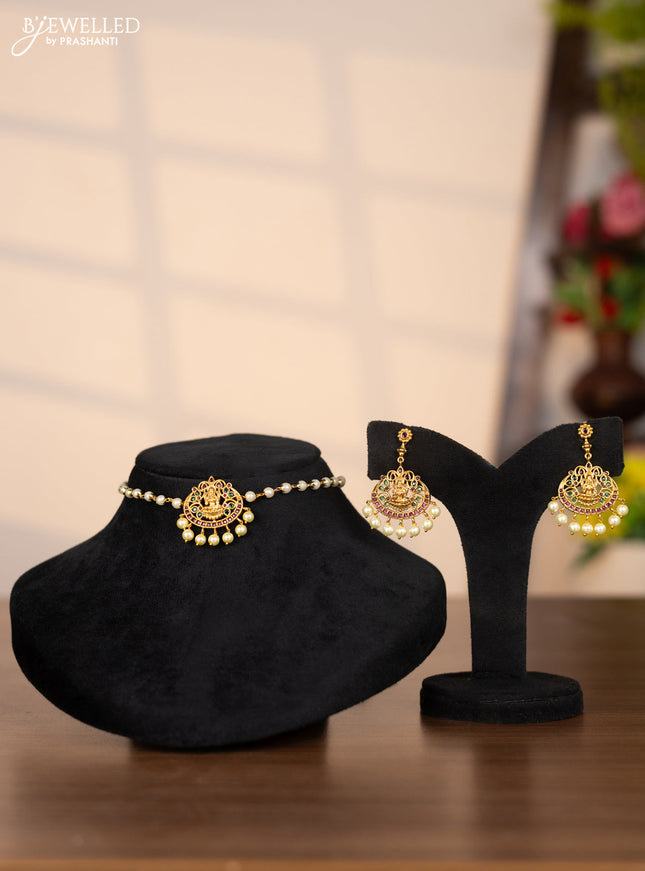 Pearl choker with lakshmi pendant in green and kemp stones