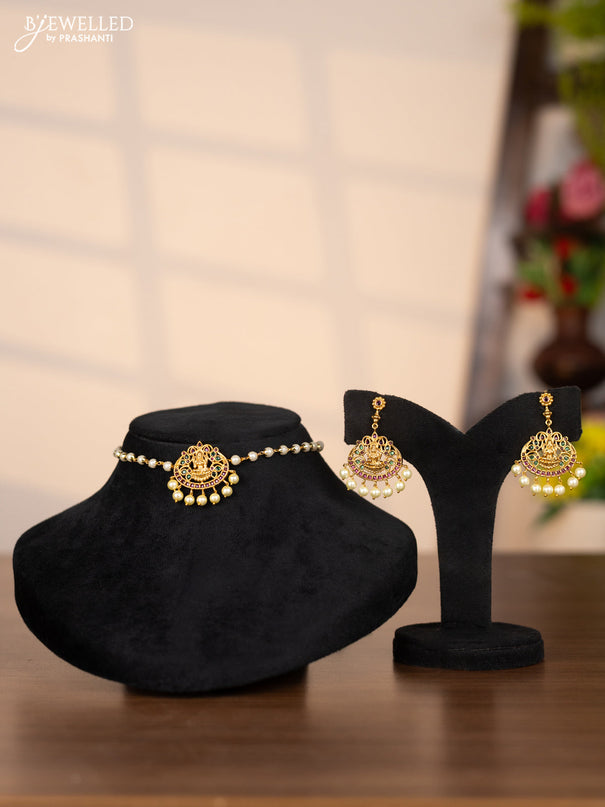 Pearl choker with lakshmi pendant in green and kemp stones