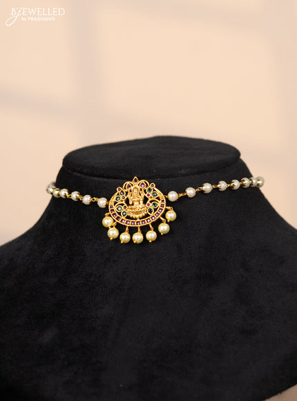 Pearl choker with lakshmi pendant in green and kemp stones