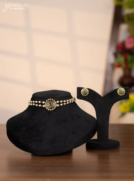 Pearl choker with floral pendant in green stones