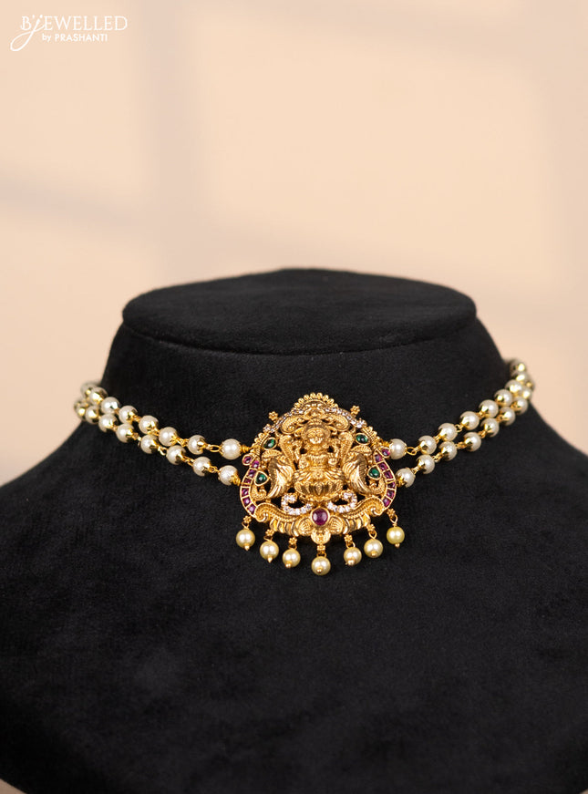 Pearl choker with lakshmi pendant in green and kemp stones