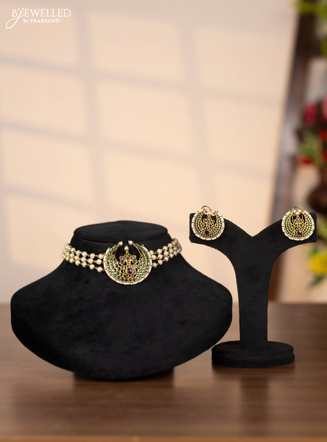 Pearl choker with chandbali pendant in green stones