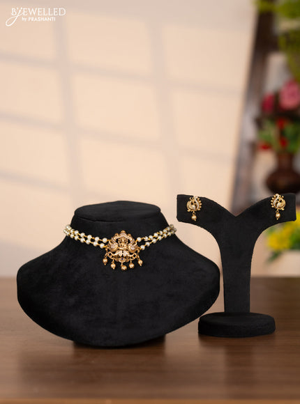 Pearl choker with lakshmi pendant in cz stones