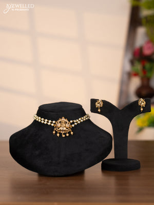 Pearl choker with lakshmi pendant in cz stones