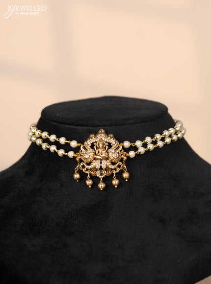 Pearl choker with lakshmi pendant in cz stones