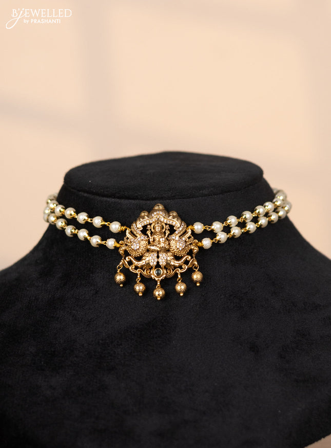 Pearl choker with lakshmi pendant in cz stones