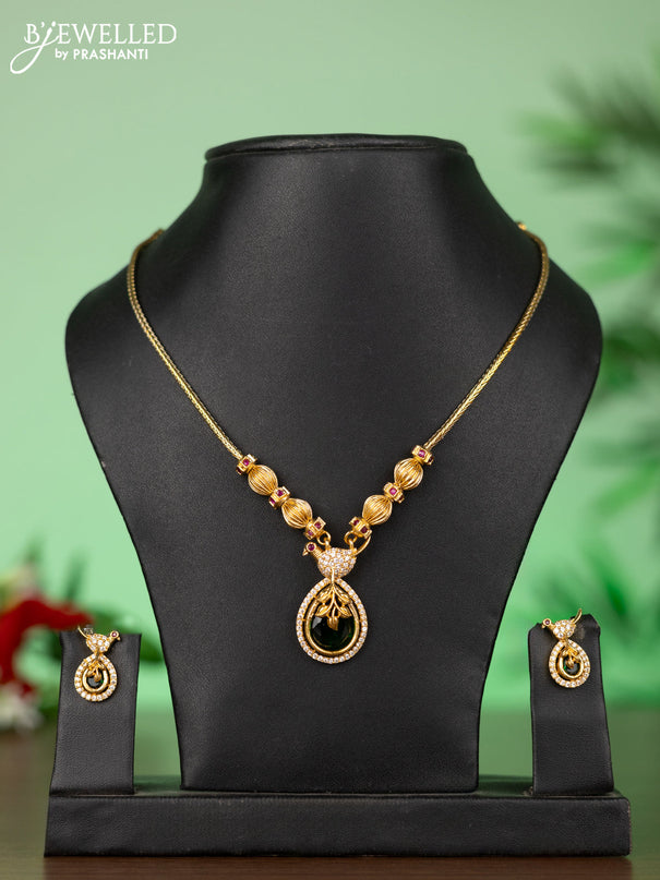 Attigai necklace with parrot pendant in green and white stones