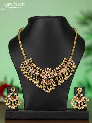 Attigai necklace with chandbali pendant in kemp,green stones and pearl hangings