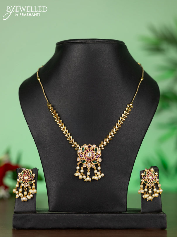Attigai necklace with lotus pendant in kemp and white stones & pearl hangings