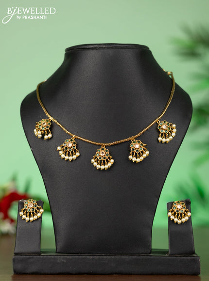 Attigai necklace with floral pendant in kemp ,white and green stones and pearl hanging