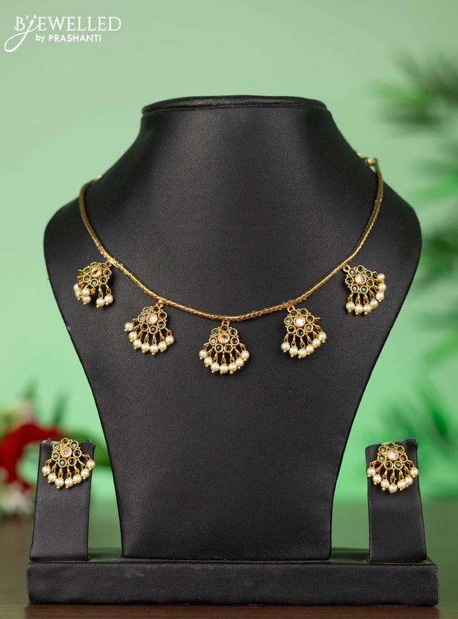 Attigai necklace with floral pendant in kemp ,white and green stones and pearl hanging