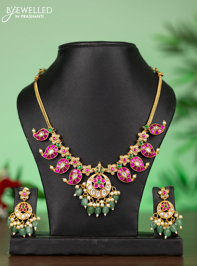 Attigai necklace with manga pendant in jadau kundan stones and green beads hanging
