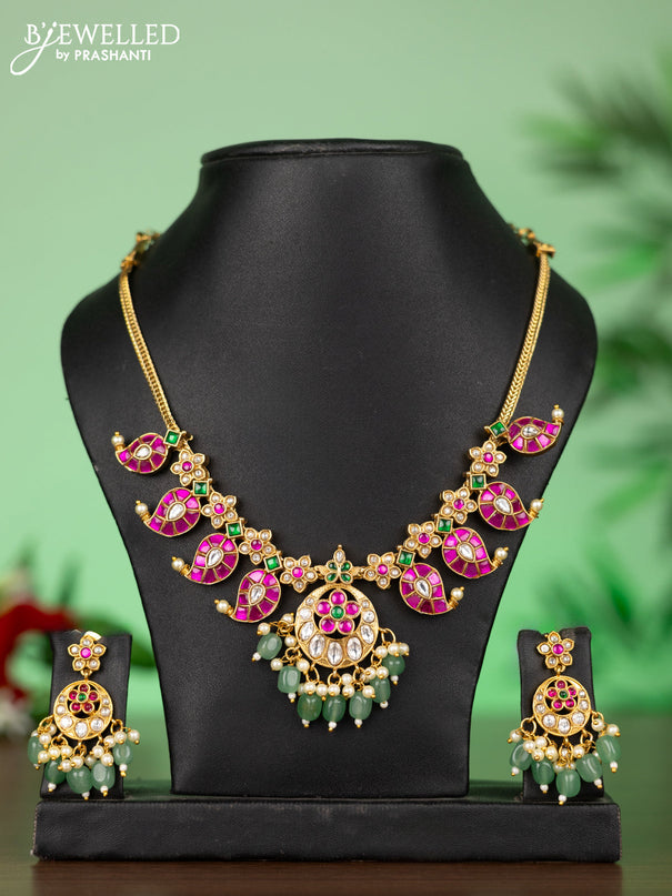 Attigai necklace with manga pendant in jadau kundan stones and green beads hanging