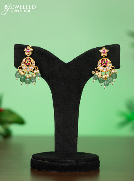 Attigai necklace with manga pendant in jadau kundan stones and green beads hanging