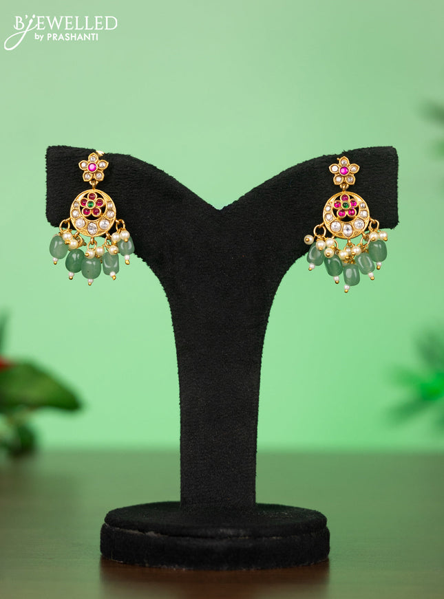 Attigai necklace with manga pendant in jadau kundan stones and green beads hanging