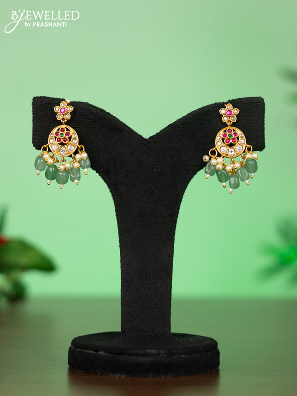Attigai necklace with manga pendant in jadau kundan stones and green beads hanging