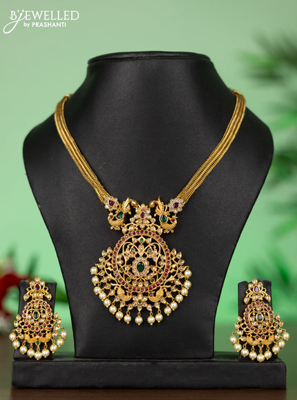 Attigai necklace with floral pendant in kemp ,white and green stones and pearl hanging