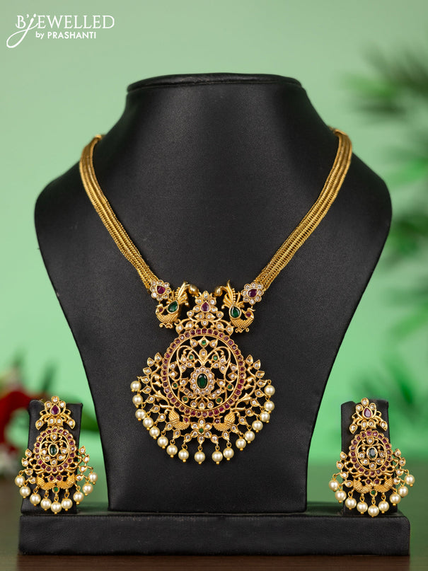 Attigai necklace with floral pendant in kemp ,white and green stones and pearl hanging