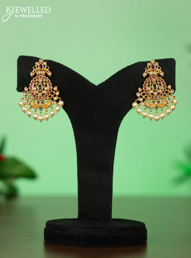 Attigai necklace with floral pendant in kemp ,white and green stones and pearl hanging