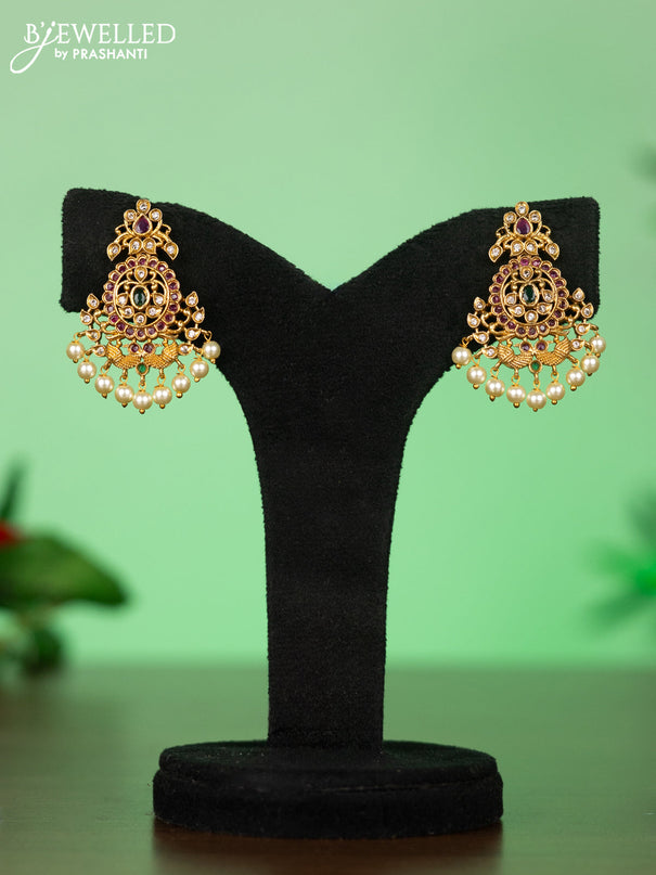 Attigai necklace with floral pendant in kemp ,white and green stones and pearl hanging