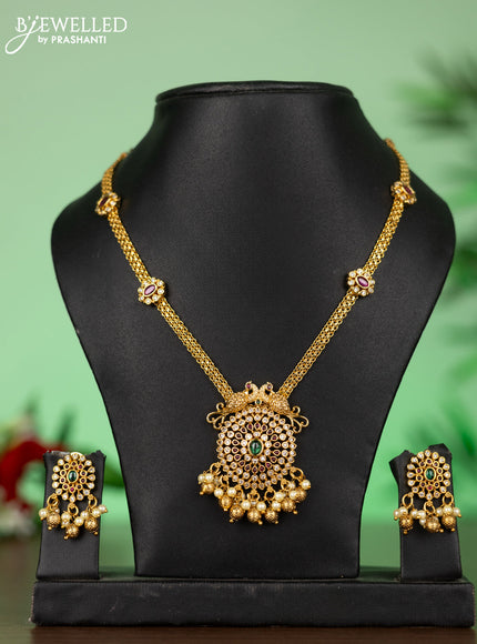 Attigai necklace with double peacock pendant in kemp ,white and green stones and pearl hanging
