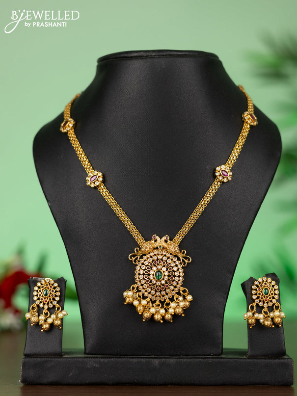 Attigai necklace with double peacock pendant in kemp ,white and green stones and pearl hanging