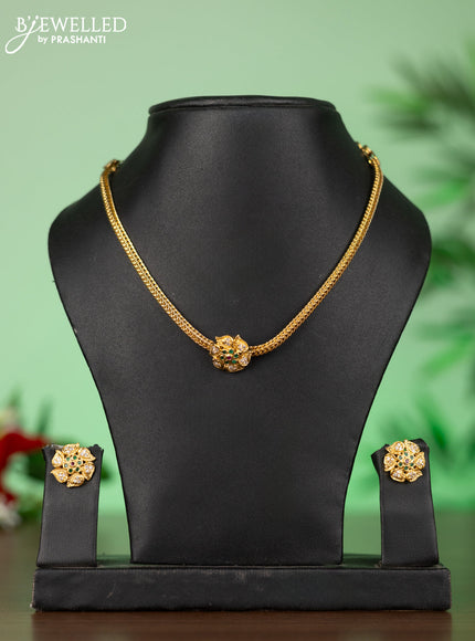 Attigai necklace with floral pendant in kemp ,white and green stones